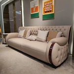 Cream Tufted Leather Sofa with Deep-Red High-Gloss Wood Side Panels